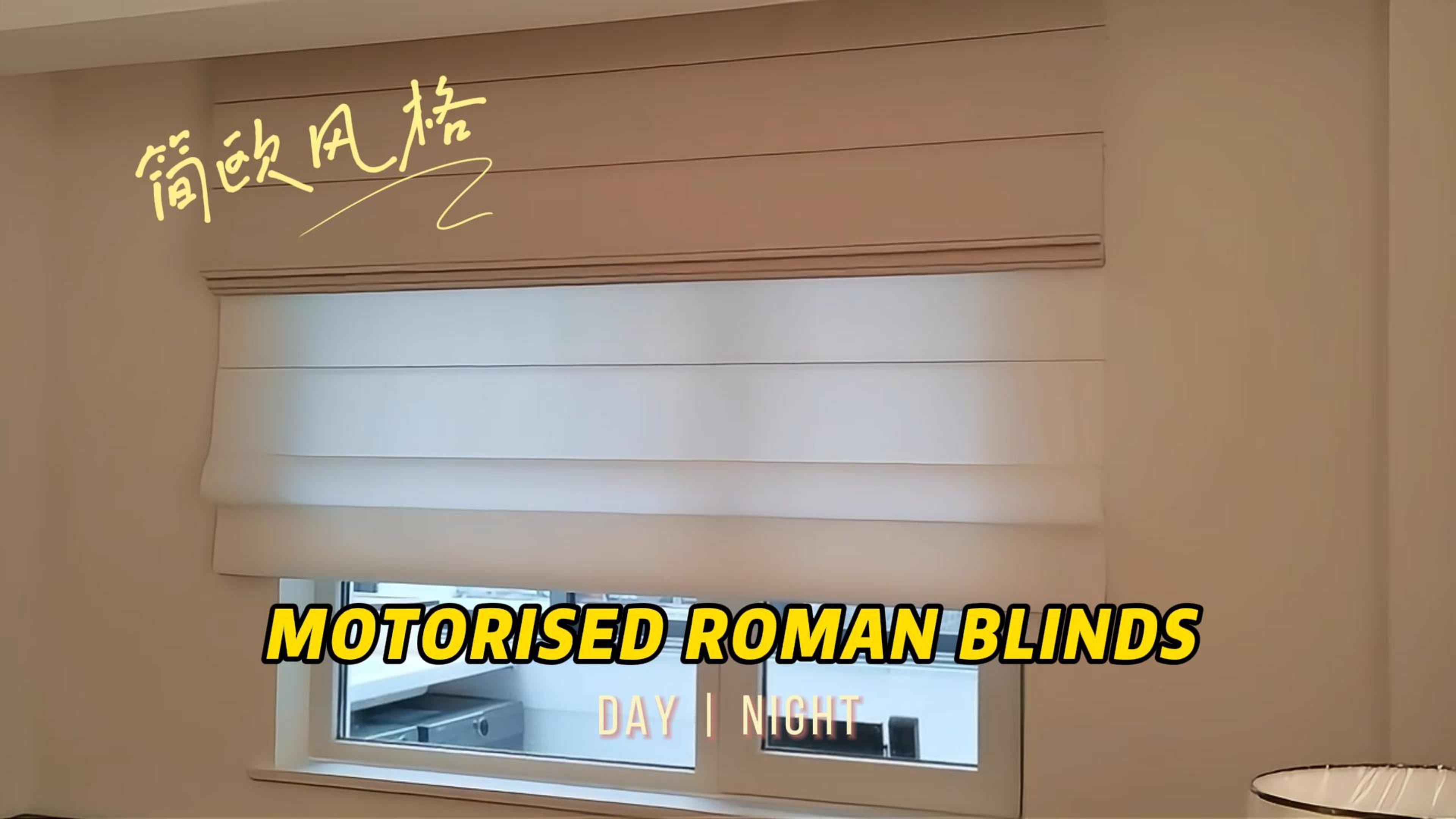 Load video: Experience the ultimate in convenience and style with our Motorised Day &amp; Night Roman Blinds. 
&lt;p&gt;&lt;/p&gt;&lt;p&gt;With a single touch, effortlessly control the light and ambiance in your room. These blinds feature a sleek and modern design, with a single piece of fabric that folds up into neat pleats when raised. Perfect for busy homes, motorised operation ensures easy and quiet operation.&lt;/p&gt;